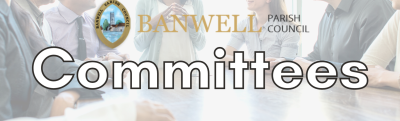 A picture of people in a meeting around a table with the text 